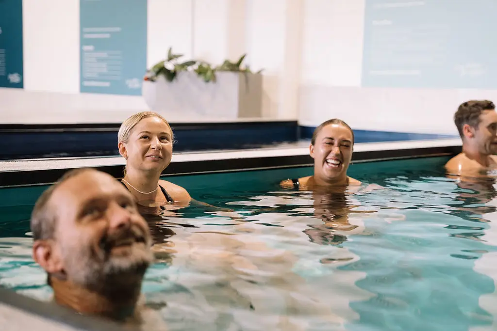 4 people in an ice bath
